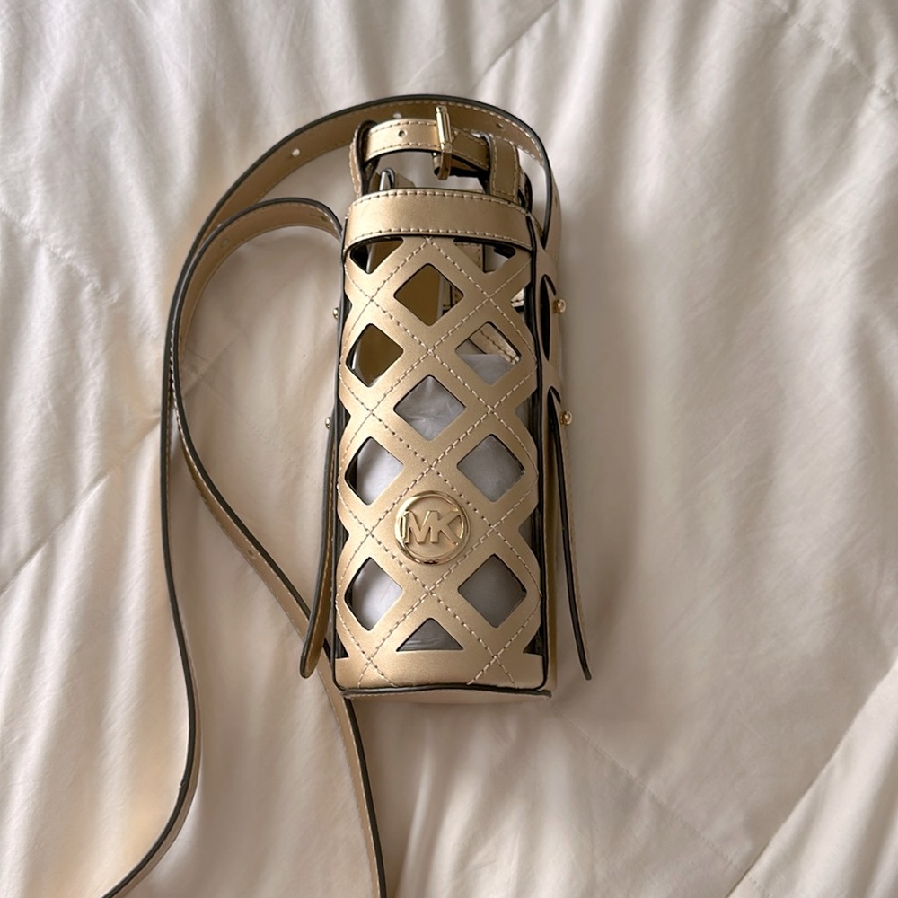 Michael Kors Aidy Pale Gold leather small water bottle holder.
